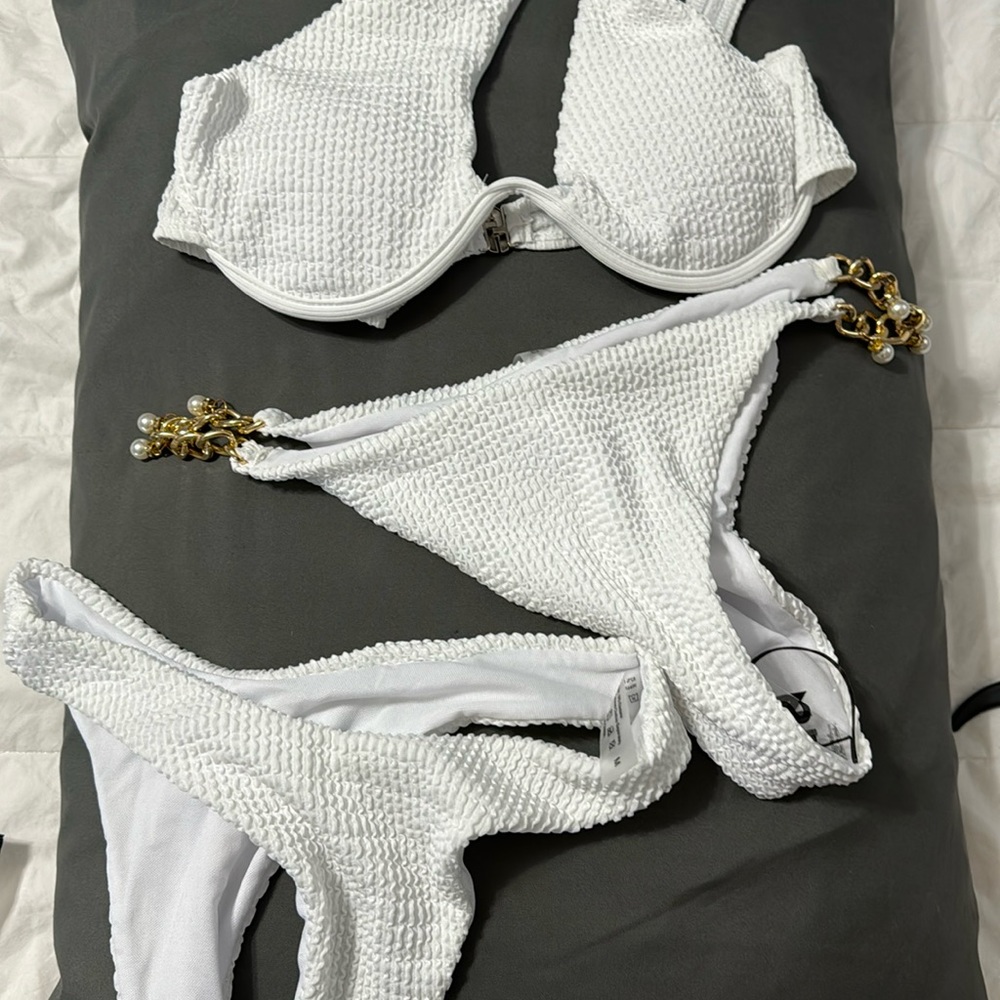 White bikini bathing suit with 2 matching bottoms